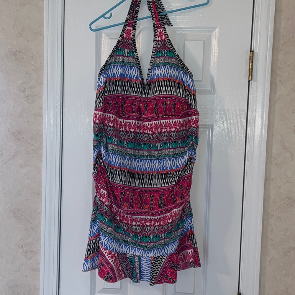 Kenneth Cole Reaction one piece with ruffle hem. Never worn.